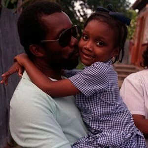 Malcolm Marshall West Indies cricketer kisses his daughter Mali, February 1990