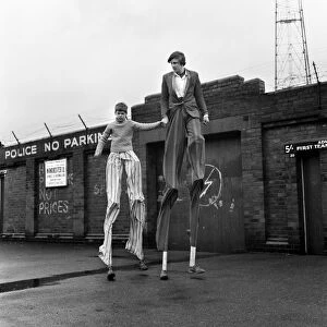 Malcolm Parry, 14, of Gorton, Manchester, is learning stiltwalking with his friend who is