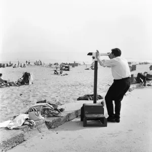 A man checking out the view across Sandbanks Beach in Poole, Dorset. June 1960 M4341 A man checking out the view across Sandbanks Beach in Poole, Dorset. June 1960 M4341