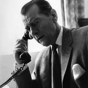 Man having a telephone conversation at his desk. Circa 1960 P009059 Man having a telephone conversation at his desk. Circa 1960 P009059