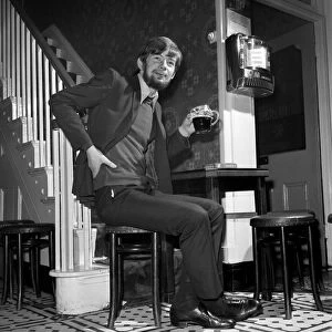 Man at home drinking a pint of beer. November 1969 Z10987-001