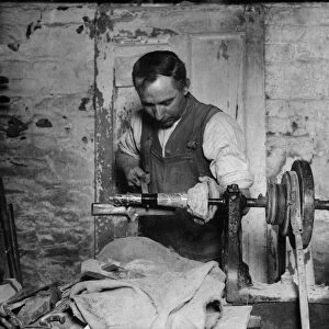 A man making stone models from rock, Cornwall. One of the industries of Penzance is