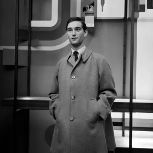A man modelling an overcoat. 24th August 1965 A man modelling an overcoat. 24th August 1965