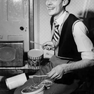 A man playing the drums using toothbrushes for drumsticks A man playing the drums using toothbrushes for drumsticks