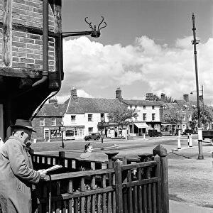 A man reading a newspaper in Beaconsfield, Buckinghamshire, 7th May 1952