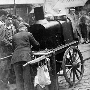 A man selling hot chesnuts on the Newcastle Streets c. 1955