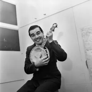 Man wearing a suit playing the Banjo. October 1969 Z10485-002 Man wearing a suit playing the Banjo. October 1969 Z10485-002