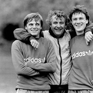 Manager Mullery gets to grips with his Strikers Gary Bannister (left) and Simon Stainrod
