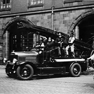 Manchester City Fire Brigade. A Fire Engine leaves the Manchester City Fire Brigade