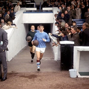 Manchester City footballer Johnny Crossan leads out his team for their match against