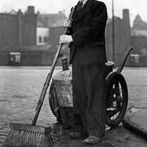 A Manchester road sweeper seen here showing of his new uniform. March 1951 P000234