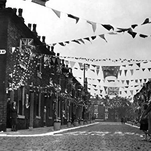 A Manchester street decked out with coronation decorations in celebration of