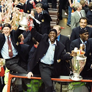 Manchester United celebrate winning the treble as the jubilant team make their way