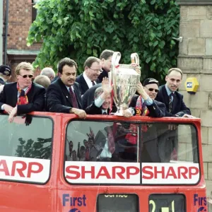 Manchester United celebrate winning the treble as the jubilant team make their way Manchester United celebrate winning the treble as the jubilant team make their way