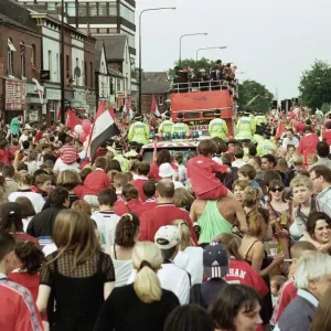 Manchester United celebrate winning the treble as the jubilant team make their way Manchester United celebrate winning the treble as the jubilant team make their way