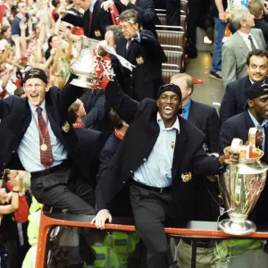 Manchester United celebrate winning the treble as the jubilant team make their way Manchester United celebrate winning the treble as the jubilant team make their way