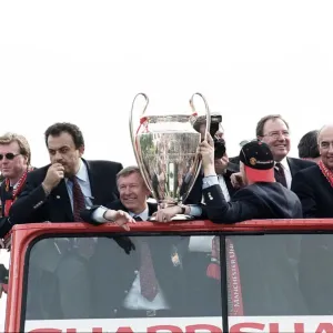 Manchester United celebrate winning the treble as the jubilant team make their way Manchester United celebrate winning the treble as the jubilant team make their way