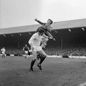 Manchester United centre-half Bill Foulkes and keeper Alex Stepney in action clearing a