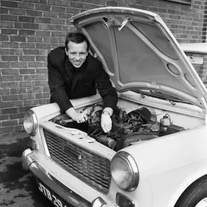 Manchester United and England footballer Nobby Stiles tends to his car engine at Old Manchester United and England footballer Nobby Stiles tends to his car engine at Old