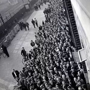 Manchester United fans queue for tickets at Old Trafford for the FA Cup semi final match