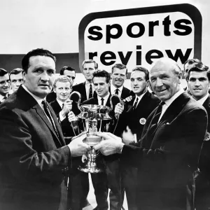 Manchester United football manager Matt Busby handing the Team of the Year Trophy to Manchester United football manager Matt Busby handing the Team of the Year Trophy to