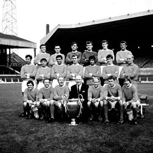 Manchester United football team pose for a group photo with European Cup at Old Trafford