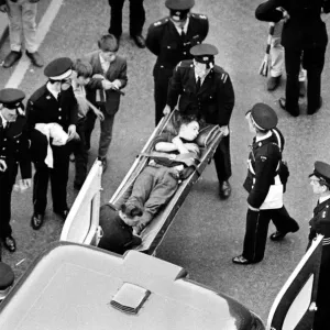 Manchester United Football Team return after winning the European Cup - An injured fan is
