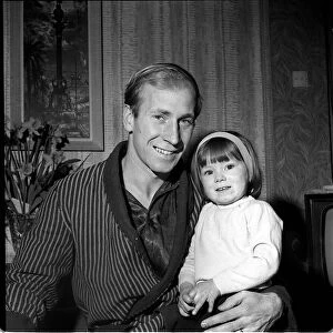 Manchester United footballer Bobby Charlton with daughter Suzanne at home March