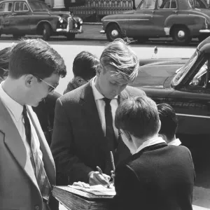 Manchester United footballer Bobby Charlton signs autographs for young fans in Hyde Park Manchester United footballer Bobby Charlton signs autographs for young fans in Hyde Park