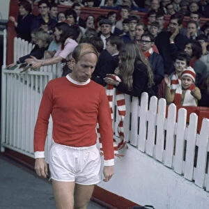 Manchester United footballer Bobby Charlton walks out fromn the tunnel onto the pitch at
