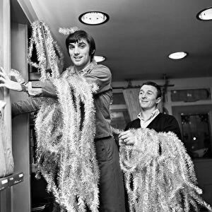 Manchester United footballer George Best decorating his Edwardian boutique 7th