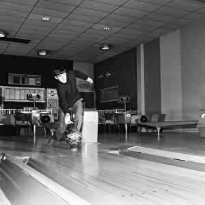 Manchester United footballer George Best bowling at the Top Rank Bowl near Trafford