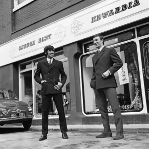 Manchester United footballer George Best celebrates the opening of his fashion boutique