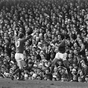 Manchester United footballer George Best celebrates after scoring the third goal against Manchester United footballer George Best celebrates after scoring the third goal against