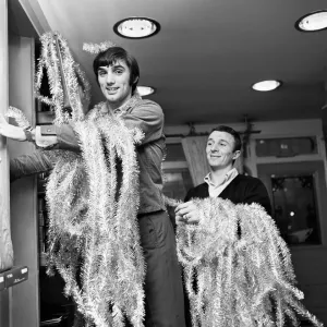 Manchester United footballer George Best decorating his Edwardian boutique 7th Manchester United footballer George Best decorating his Edwardian boutique 7th