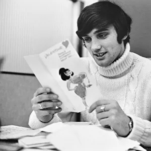 Manchester United footballer George Best reading his Valentines cards