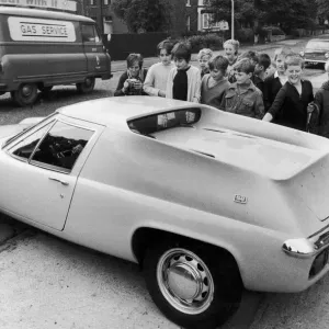 George Best with Young Fans in Yellow Lotus Europa Print (1969)
