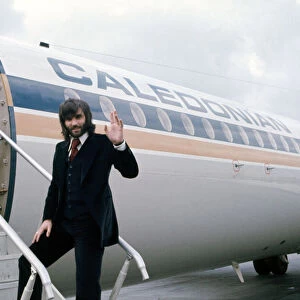 Manchester United footballer George Best waves before boarding his plane October