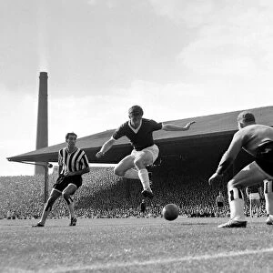 Manchester United forward Dennis Viollet shoots at goal past the Newcastle United