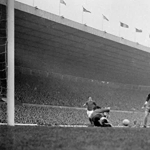 Manchester United forward George Best has his shot saved at point blank range by Chelsea