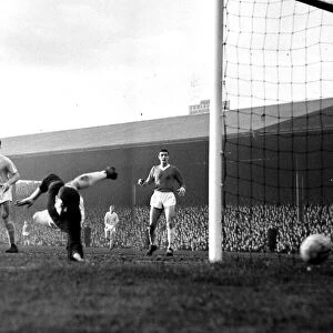 Manchester United goalkeper Harry Gregg saves again during a Manchester City attack in