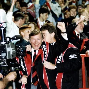 Manchester United manager Alex Ferguson celebrates with assistant Brian Kidd as his team Manchester United manager Alex Ferguson celebrates with assistant Brian Kidd as his team