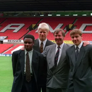 Manchester United manager Alex Ferguson poses with new signings left to right Manchester United manager Alex Ferguson poses with new signings left to right