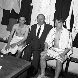 Manchester United manager Matt Busby with two of his players Johnny Berry (left