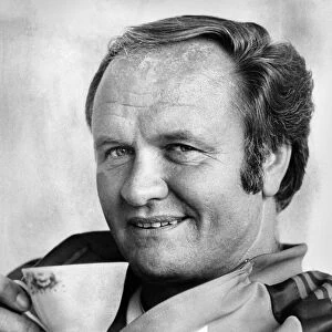 Manchester United manager Ron Atkinson relaxing in his office at the United training