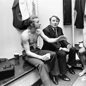 Manchester United manager Tommy Docherty with players Denis Law (left