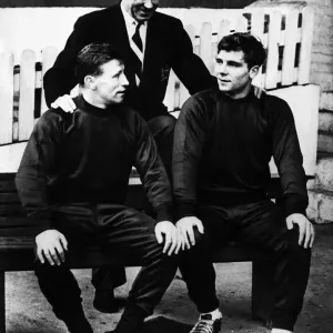 Manchester United manger Matt Busby with two of his young players Roger Byrne (left Manchester United manger Matt Busby with two of his young players Roger Byrne (left