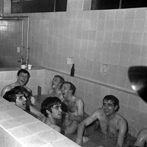 Manchester United players in bath after victory in April 1965