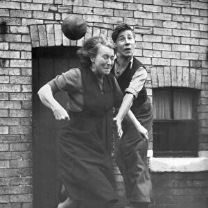 Manchester United starlet Bobby Charlton practices his heading skills with his mum