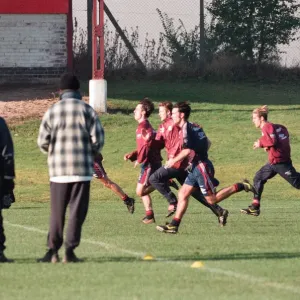 Manchester United in training. David Beckham running with Gary and Phil Neville Manchester United in training. David Beckham running with Gary and Phil Neville